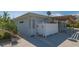 Outdoor shower on a sunny day with tropical foliage at 619 Buttonwood Dr, Longboat Key, FL 34228