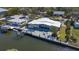 Stunning waterfront home with a boat dock and a waterfront patio for entertaining guests at 619 Buttonwood Dr, Longboat Key, FL 34228
