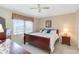 Bedroom boasts large window, natural light, and hardwood furniture at 649 S Tamiami Trl # 210, Venice, FL 34285