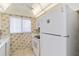 View of kitchen featuring white appliances at 649 S Tamiami Trl # 210, Venice, FL 34285