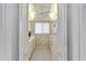 Galley kitchen featuring white appliances and cabinets at 649 S Tamiami Trl # 210, Venice, FL 34285