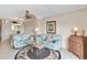 Comfortable living room with tile floors, ceiling fan, comfortable furniture, and a dining area at 649 S Tamiami Trl # 210, Venice, FL 34285