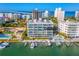 Aerial view of waterfront condos with deeded boat slips and pool at 650 Golden Gate Pt # 403, Sarasota, FL 34236