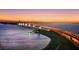 Stunning aerial view of bridge at sunset with city skyline in background at 650 Golden Gate Pt # 403, Sarasota, FL 34236