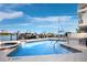 Community pool and hot tub with marina views and boat docks at 650 Golden Gate Pt # 403, Sarasota, FL 34236