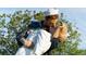 Statue of a sailor kissing a Personal in celebration, with a tree and bright sky as the backdrop at 650 Golden Gate Pt # 403, Sarasota, FL 34236