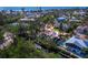 The aerial view shows the home has convenient canal access and is near the open water of the Gulf of Mexico at 650 Penfield St, Longboat Key, FL 34228