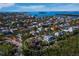 Aerial view of a neighborhood with canals, waterways, and multiple homes near the water at 650 Penfield St, Longboat Key, FL 34228