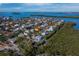 This aerial view showcases the property's prime location, nestled amidst lush greenery and tranquil waterways at 650 Penfield St, Longboat Key, FL 34228