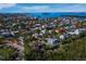 An aerial view of a neighborhood with canals, waterways, and multiple homes near the water at 650 Penfield St, Longboat Key, FL 34228