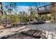 The backyard features tropical plants, landscaping, a deck, and gravel beds at 650 Penfield St, Longboat Key, FL 34228