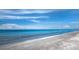 Gorgeous ocean view with calming waves and a sandy shore with shells at 650 Penfield St, Longboat Key, FL 34228