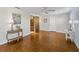 Large bedroom with wood floors, ceiling fan, and views into an open closet at 650 Penfield St, Longboat Key, FL 34228