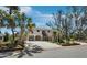 Charming stilted home with covered parking, tropical landscaping and a red front door, perfect for island living at 650 Penfield St, Longboat Key, FL 34228