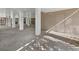 Ground floor space with a concrete floor, columns, a door, and lattice; suitable for storage or recreation at 650 Penfield St, Longboat Key, FL 34228