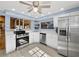 Cozy kitchen with stainless steel appliances, white cabinetry, and natural light at 650 Penfield St, Longboat Key, FL 34228