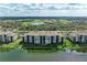 Waterfront condo with meticulously maintained landscaping, lake views, and outdoor amenities at 7019 River Hammock Dr # 104, Bradenton, FL 34212