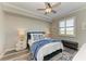 Well-lit bedroom featuring a ceiling fan, plantation shutters, and stylish decor at 7019 River Hammock Dr # 104, Bradenton, FL 34212