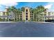 Well-maintained condo building with attractive landscaping, covered parking, and easy access at 7019 River Hammock Dr # 104, Bradenton, FL 34212