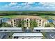 Beautiful building exterior with multiple units and scenic landscaping and parking at 7019 River Hammock Dr # 104, Bradenton, FL 34212