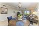 Open concept dining area with backyard view and modern light fixture at 7019 River Hammock Dr # 104, Bradenton, FL 34212