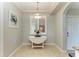 Cozy breakfast nook with a white table beneath a decorative pendant light at 7019 River Hammock Dr # 104, Bradenton, FL 34212