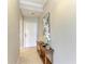 Hallway view with table and decorations at 7019 River Hammock Dr # 104, Bradenton, FL 34212