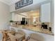 Kitchen featuring a granite countertop and seating area at 7019 River Hammock Dr # 104, Bradenton, FL 34212