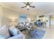 Spacious living room with dining area, view to kitchen and comfortable seating at 7019 River Hammock Dr # 104, Bradenton, FL 34212