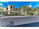 Convenient parking near the building entrances with manicured landscaping and reserved spaces at 7019 River Hammock Dr # 104, Bradenton, FL 34212