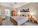 Cozy bedroom with decorative wooden wall art, plush carpet, and natural light from the doorway enhance the room's comfort at 7340 Golf Pointe Cir, Sarasota, FL 34243