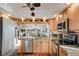 Kitchen featuring stainless steel appliances, a breakfast bar, and ample countertop space at 7340 Golf Pointe Cir, Sarasota, FL 34243