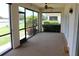 This spacious lanai boasts serene views of the water and landscaping, ideal for relaxation and enjoying the outdoors at 7340 Golf Pointe Cir, Sarasota, FL 34243