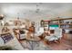 Spacious living room with hardwood floors, custom built-ins, and bright, natural light at 7340 Golf Pointe Cir, Sarasota, FL 34243
