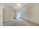 Bright, neutral bedroom with soft gray carpeting, white trim, and a ceiling fan at 7632 Plantation Cir, Bradenton, FL 34201