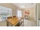 Bright dining area with modern table set, window, and backyard access at 7632 Plantation Cir, Bradenton, FL 34201