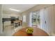 A dining area leads to a bright kitchen and a screened-in patio through sliding glass doors at 7632 Plantation Cir, Bradenton, FL 34201