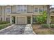 Charming townhome showcases a well-kept front yard, garage, and covered entrance at 7632 Plantation Cir, Bradenton, FL 34201