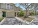 Inviting townhome exterior features well-maintained landscaping, and a garage with driveway at 7632 Plantation Cir, Bradenton, FL 34201