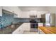Bright kitchen features white cabinets, stainless steel appliances, granite countertops, and a colorful backsplash at 7632 Plantation Cir, Bradenton, FL 34201