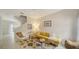 Bright living room with stylish furniture, patterned rug, and staircase at 7632 Plantation Cir, Bradenton, FL 34201