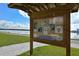 Community bulletin board with park information and schedules with a view of the lake at 7632 Plantation Cir, Bradenton, FL 34201