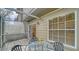 Covered patio with furniture offering a cozy spot, featuring access to the home's interior at 7632 Plantation Cir, Bradenton, FL 34201