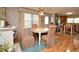 Dining area with hardwood floors conveniently situated between the living room and kitchen at 793 N Green Cir, Venice, FL 34285