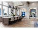 Open kitchen with an oversized island, pendant lighting, and bar stool seating at 8271 Redonda Loop, Lakewood Ranch, FL 34202