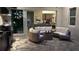 Outdoor living space featuring a built-in kitchen, and comfortable seating area that flows into the home at 8271 Redonda Loop, Lakewood Ranch, FL 34202