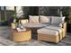 Outdoor living space with rattan furniture and landscaping surrounding at 8271 Redonda Loop, Lakewood Ranch, FL 34202