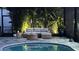 Screened in pool area featuring lush tropical landscaping and comfortable outdoor seating at 8271 Redonda Loop, Lakewood Ranch, FL 34202