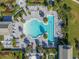 Aerial view of a luxurious community pool area with ample seating and lush landscaping at 8271 Redonda Loop, Lakewood Ranch, FL 34202