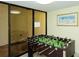 Community game room featuring a foosball table and adjacent seating at 8764 Midnight Pass Rd # A301, Sarasota, FL 34242